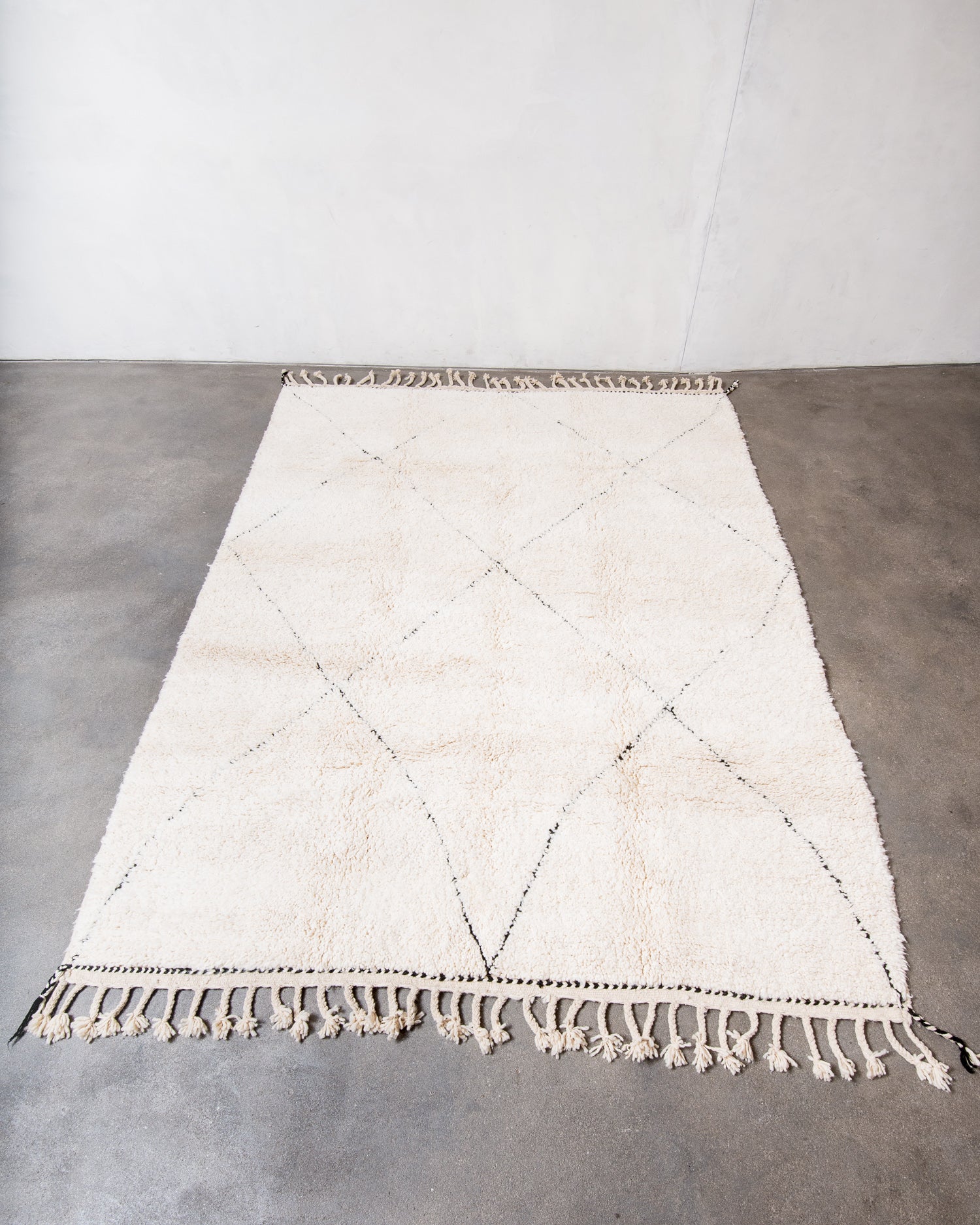 Modern, designer, handcrafted Berber rug from Morocco. Beniourain carpet with minimalist design, natural wool pile and a fluffy texture.